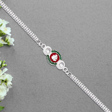 Shiny Silver Rakhi With Ganesha Emblem And Elegant Dual Chain Design