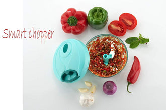 Hand-held vegetable chopper with stainless steel blades, detailed view.