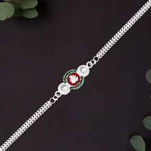 Shiny Silver Rakhi With Ganesha Emblem And Elegant Dual Chain Design